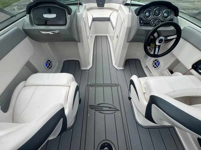 Slide: The Image of 2021 Chaparral 19 SSI Sport boat interior with modern dashboard and seating. - 15