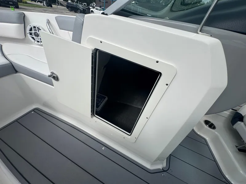 Slide: The Image of Open storage compartment on 2021 Chaparral 19 SSI Sport boat interior. - 17