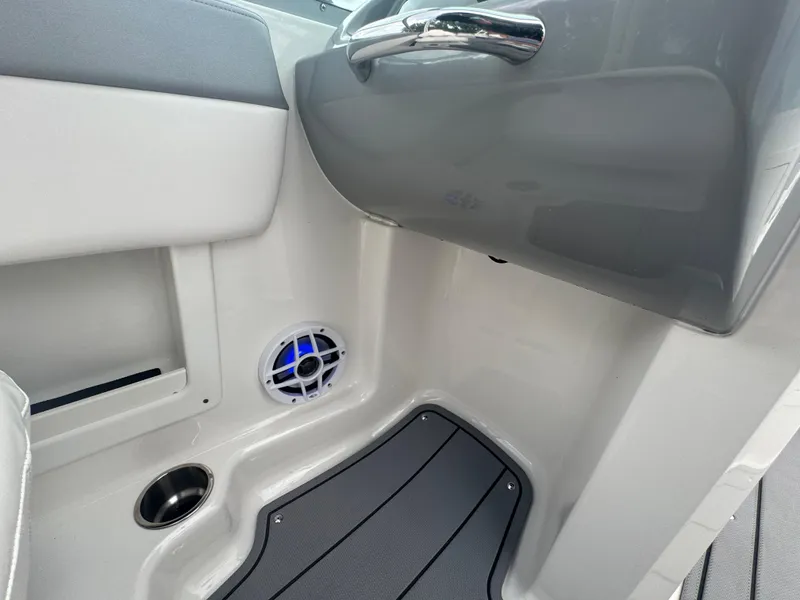 Slide: The Image of Interior of 2021 Chaparral 19 SSI Sport boat with speaker and cup holder. - 18