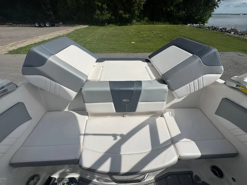 Slide: The Image of 2021 Chaparral 19 SSI Sport boat interior with gray and white seating. - 7