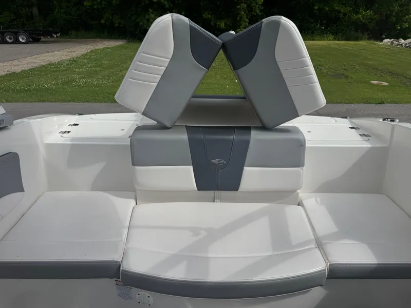 Slide: The Image of 2021 Chaparral 19 SSI Sport boat interior with white and gray seating. - 8