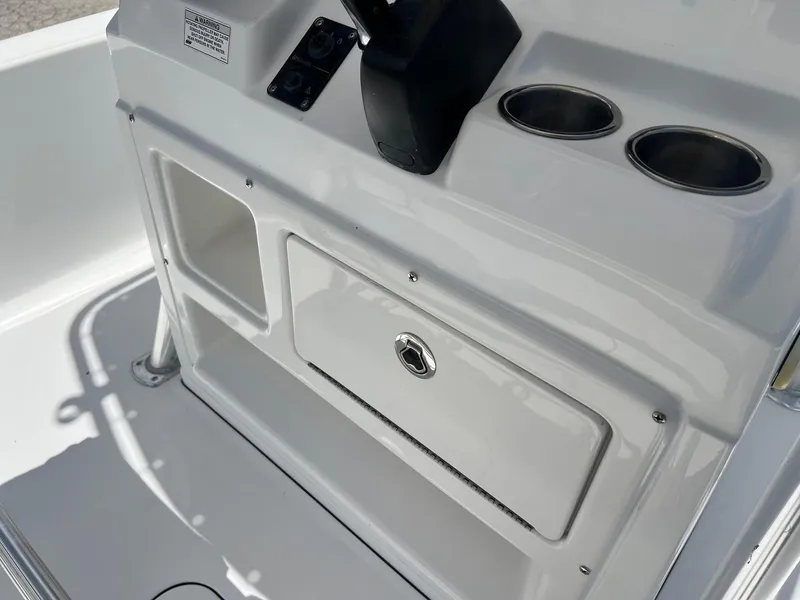 Slide: The Image of 2015 Sportsman Masters 247 Bay Boat console with storage and cup holders. - 13