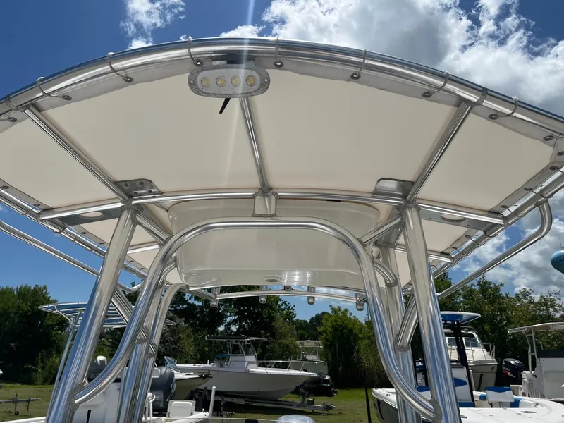 Slide: The Image of 2015 Sportsman Masters 247 Bay Boat T-top under sunny sky. - 16