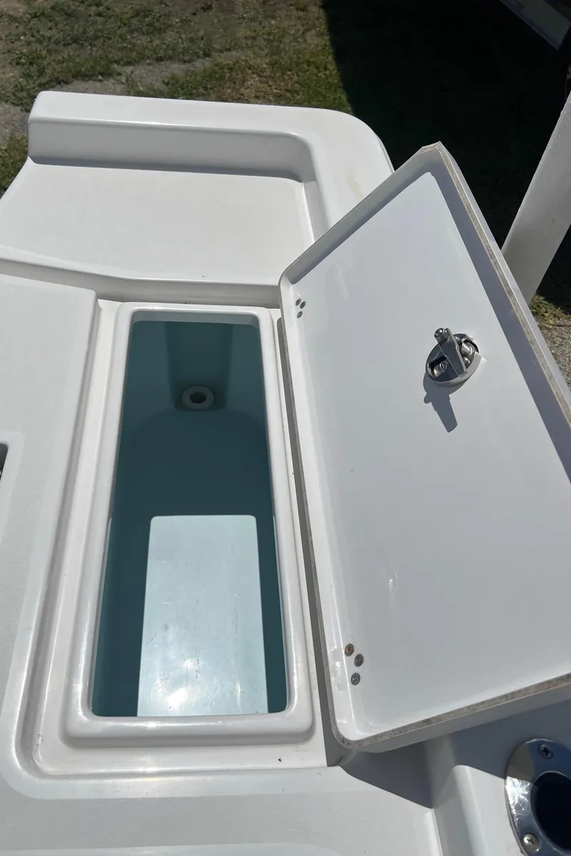 Slide: The Image of Open storage compartment on a 2015 Sportsman Masters 247 Bay Boat. - 26