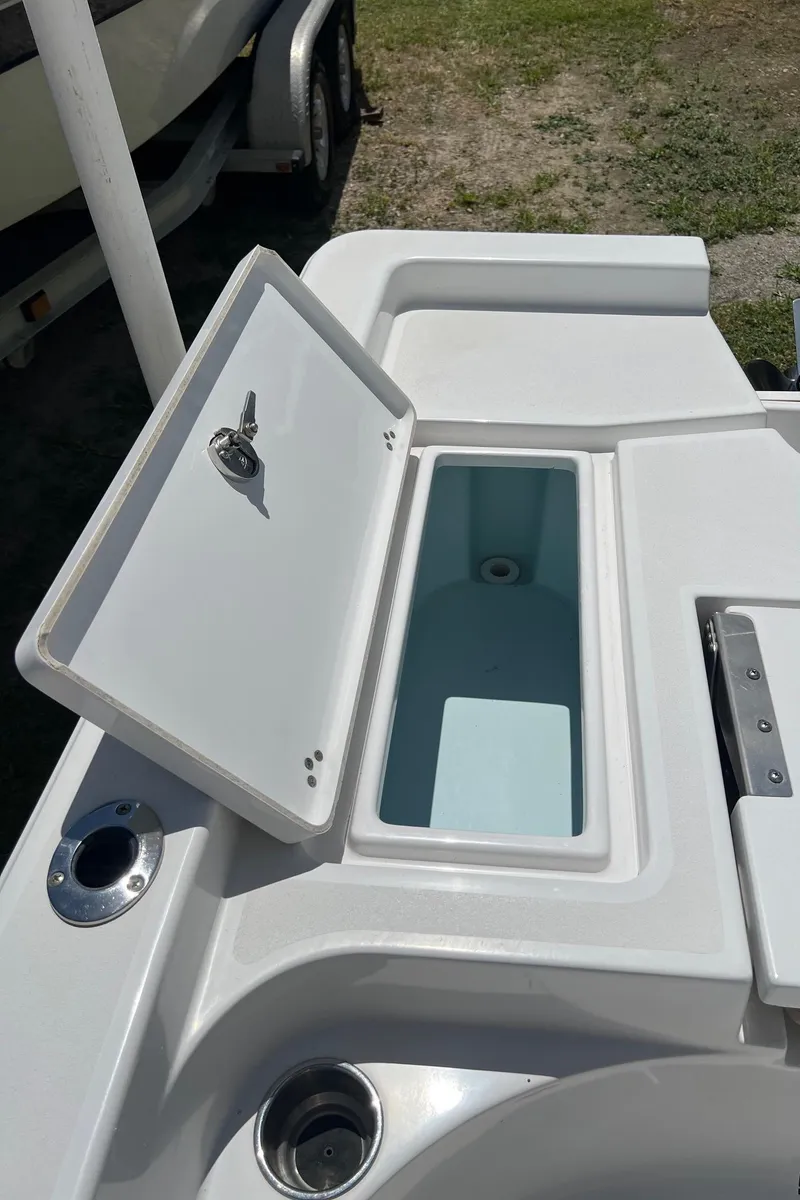 Slide: The Image of Open storage compartment on 2015 Sportsman Masters 247 Bay Boat, showing interior details. - 27