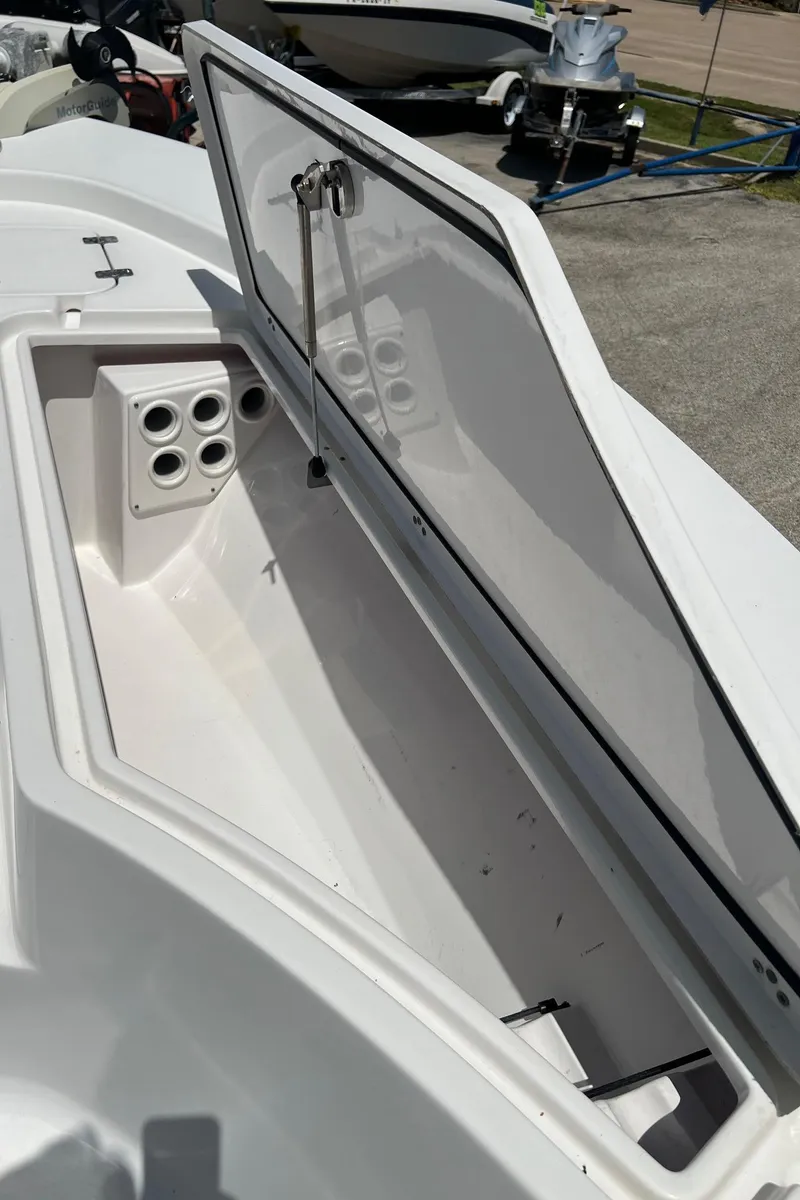 Slide: The Image of Open storage compartment on a 2015 Sportsman Masters 247 Bay Boat. - 28
