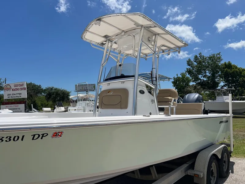 Slide: The Image of 2015 Sportsman Masters 247 Bay Boat on trailer under clear blue sky. - 3