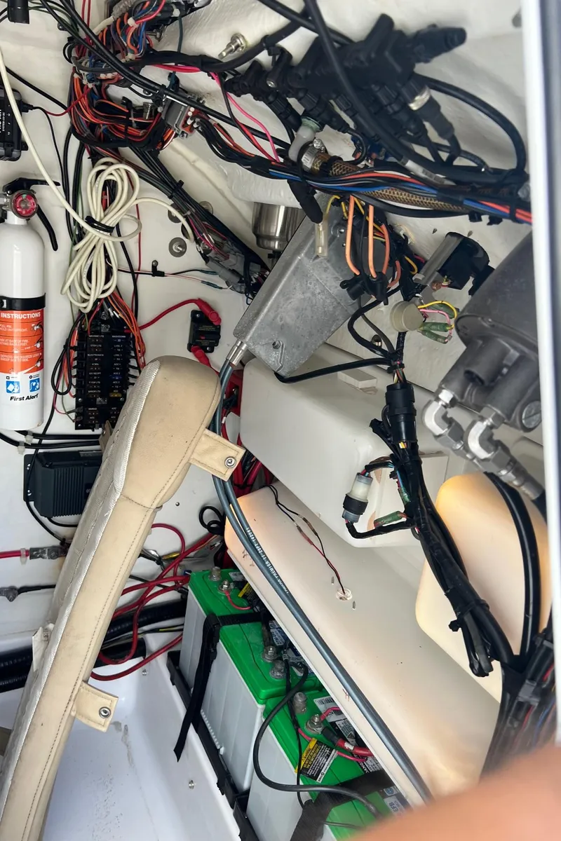Slide: The Image of Interior view of a 2015 Sportsman Masters 247 Bay Boat showing wiring and components. - 33