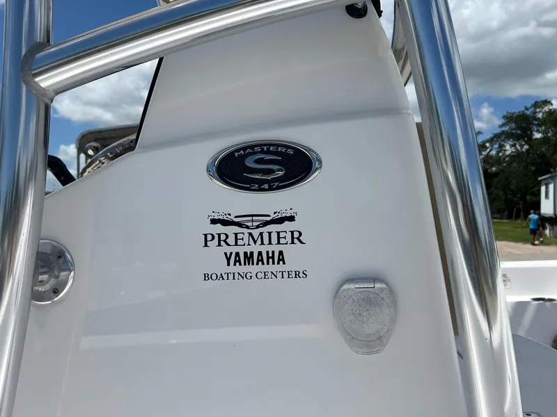 Slide: The Image of 2015 Sportsman Masters 247 Bay Boat with Premier Yamaha Boating Centers logo. - 6
