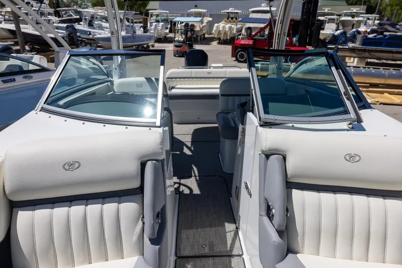Slide: The Image of 2019 Cobalt 25SC boat interior with plush seating and open deck layout. - 16