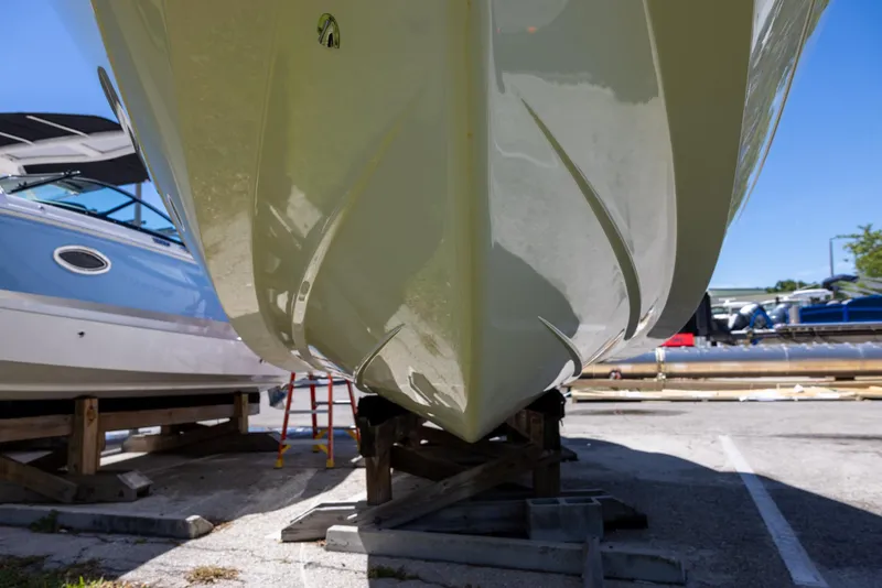 Slide: The Image of 2019 Cobalt 25SC boat hull on dry dock, viewed from below. - 4