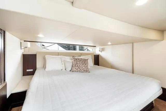 Slide: The Image of Luxurious bedroom interior of 2017 Regal 42 Grande Coupe yacht. - 10