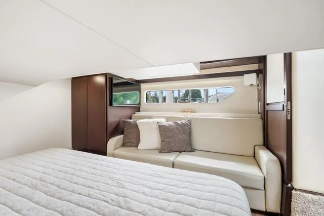 Slide: The Image of Luxurious interior of 2017 Regal 42 Grande Coupe yacht with cozy bed and sofa. - 12