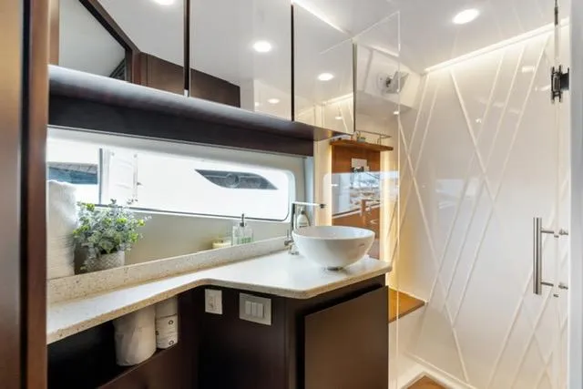 Slide: The Image of Luxurious bathroom interior of 2017 Regal 42 Grande Coupe yacht with modern fixtures. - 13