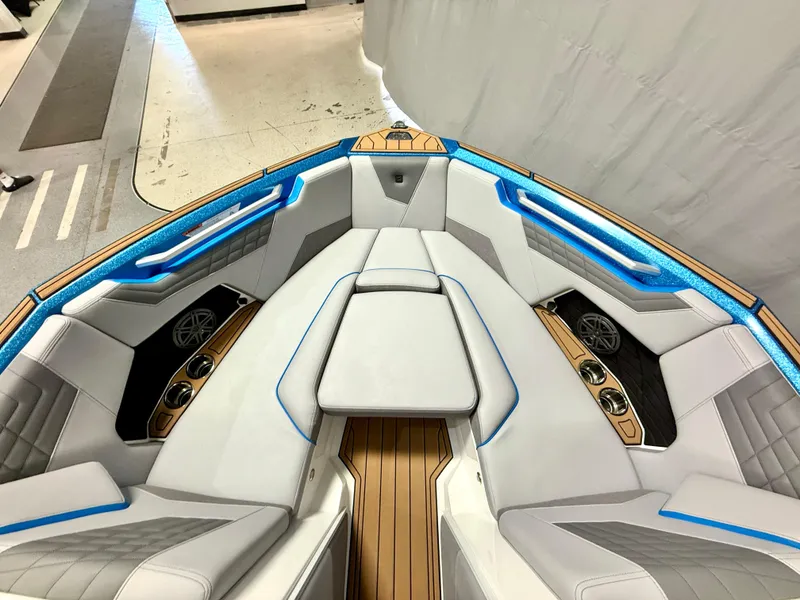 Slide: The Image of 2025 Nautique Super Air Nautique S23 boat interior with luxurious seating and modern design. - 11