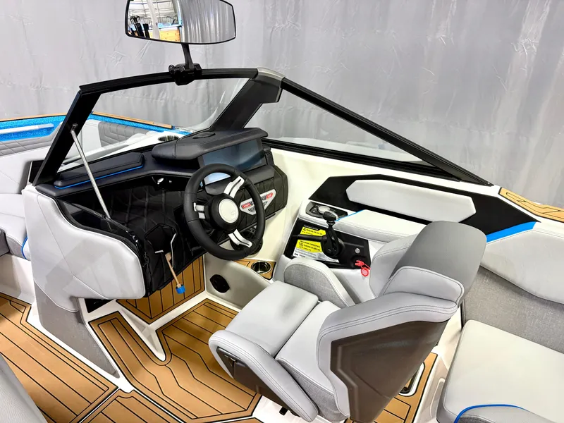 Slide: The Image of 2025 Nautique Super Air Nautique S23 interior with modern dashboard and steering wheel. - 12
