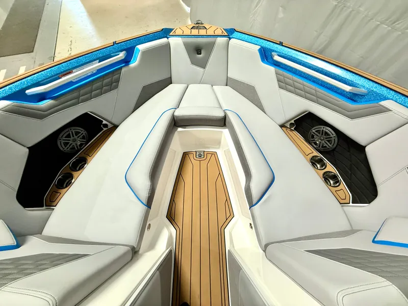 Slide: The Image of 2025 Nautique Super Air Nautique S23 boat interior with luxurious seating and modern design. - 21