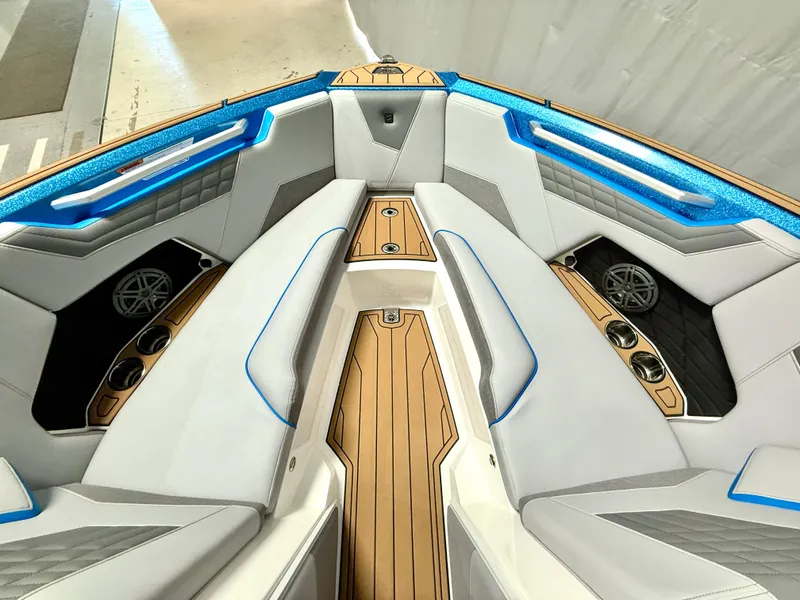 Slide: The Image of 2025 Nautique Super Air Nautique S23 interior with sleek seating and modern design. - 22