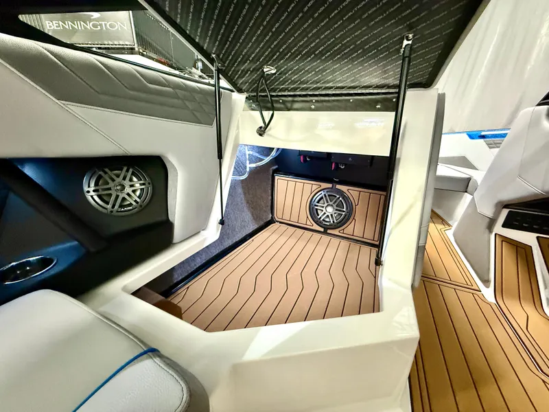 Slide: The Image of Interior of 2025 Nautique Super Air Nautique S23 with premium audio system and wood flooring. - 24