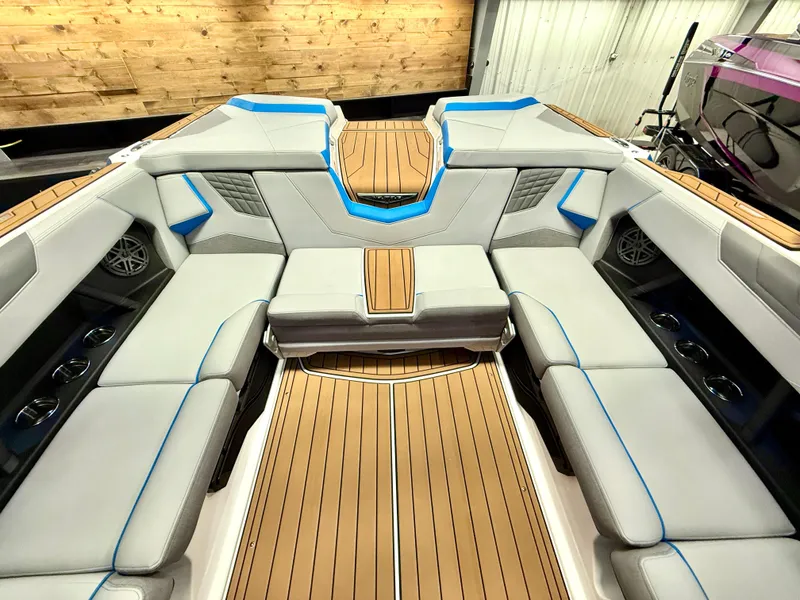 Slide: The Image of 2025 Nautique Super Air Nautique S23 interior with luxurious seating and modern design. - 28