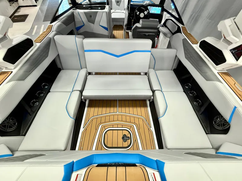 Slide: The Image of 2025 Nautique Super Air Nautique S23 interior with sleek seating and modern dashboard. - 29
