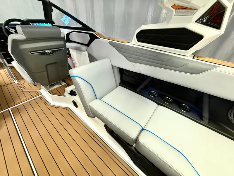 Slide: The Image of 2025 Nautique Super Air Nautique S23 interior with sleek seating and modern dashboard design. - 33