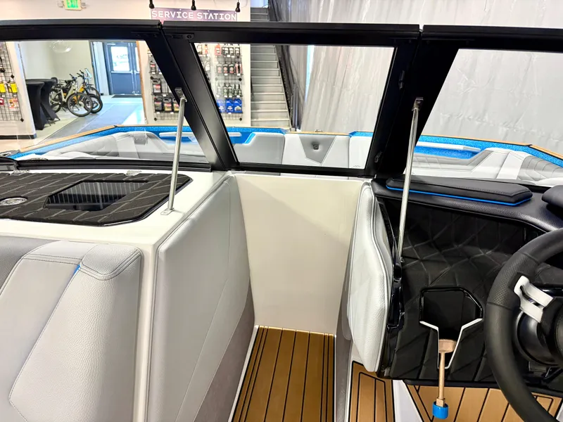 Slide: The Image of Interior of 2025 Nautique Super Air Nautique S23 boat, featuring modern design and seating. - 45