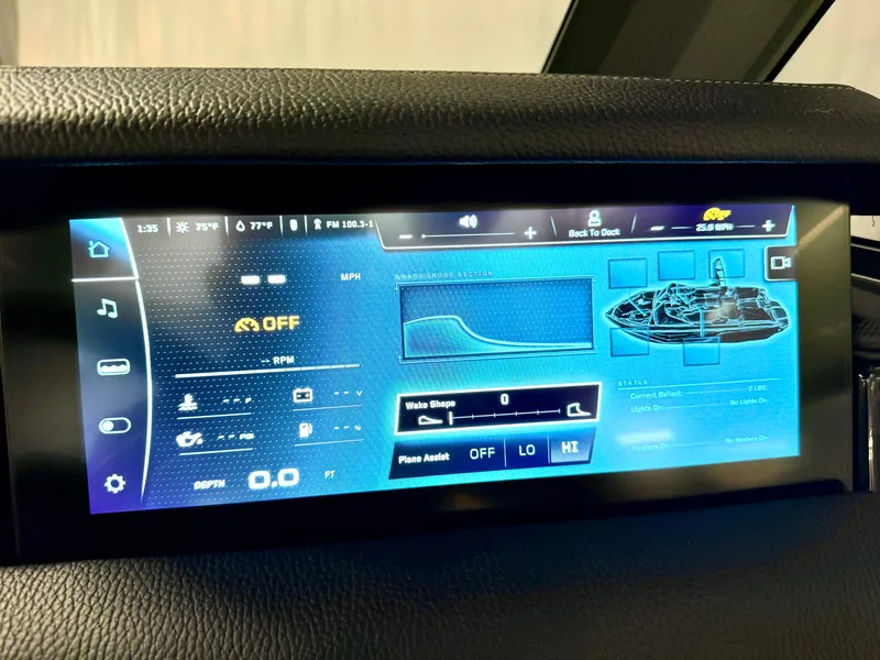 Slide: The Image of 2025 Nautique Super Air Nautique S23 touchscreen display showing boat controls and settings. - 48
