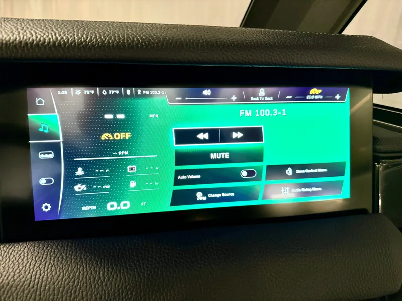 Slide: The Image of Touchscreen display of 2025 Nautique Super Air Nautique S23 boat, showing audio controls and settings. - 49
