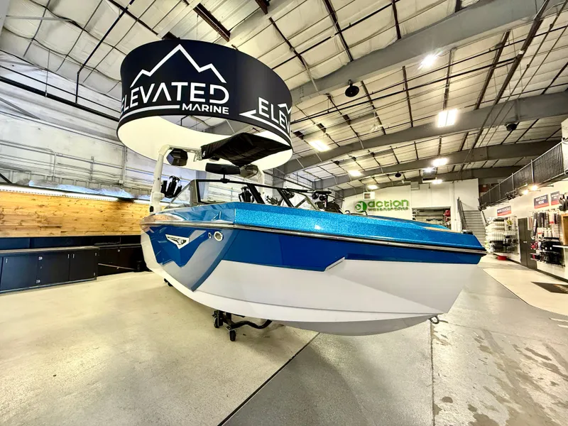 Slide: The Image of 2025 Nautique Super Air Nautique S23 boat displayed at Elevated Marine showroom. - 7