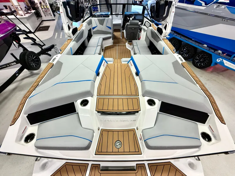 Slide: The Image of 2025 Nautique Super Air Nautique S23 interior with sleek seating and modern design. - 9