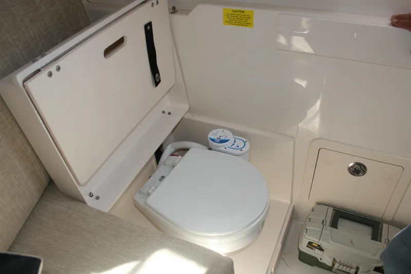 Slide: The Image of 2021 Grady-White 232 Gulfstream boat interior with compact marine toilet. - 14