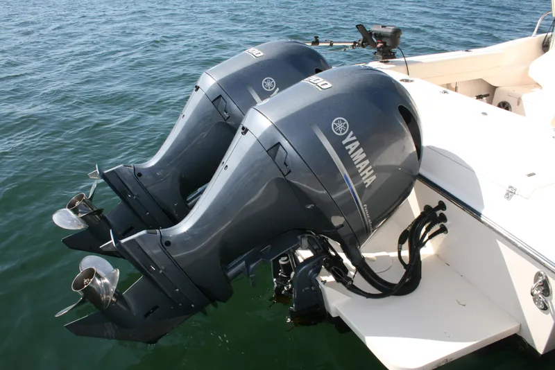 Slide: The Image of Twin Yamaha outboard motors on a 2021 Grady-White 232 Gulfstream boat. - 18