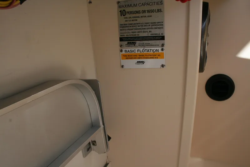 Slide: The Image of 2021 Grady-White 232 Gulfstream boat capacity label, showing maximum weight and flotation details. - 7