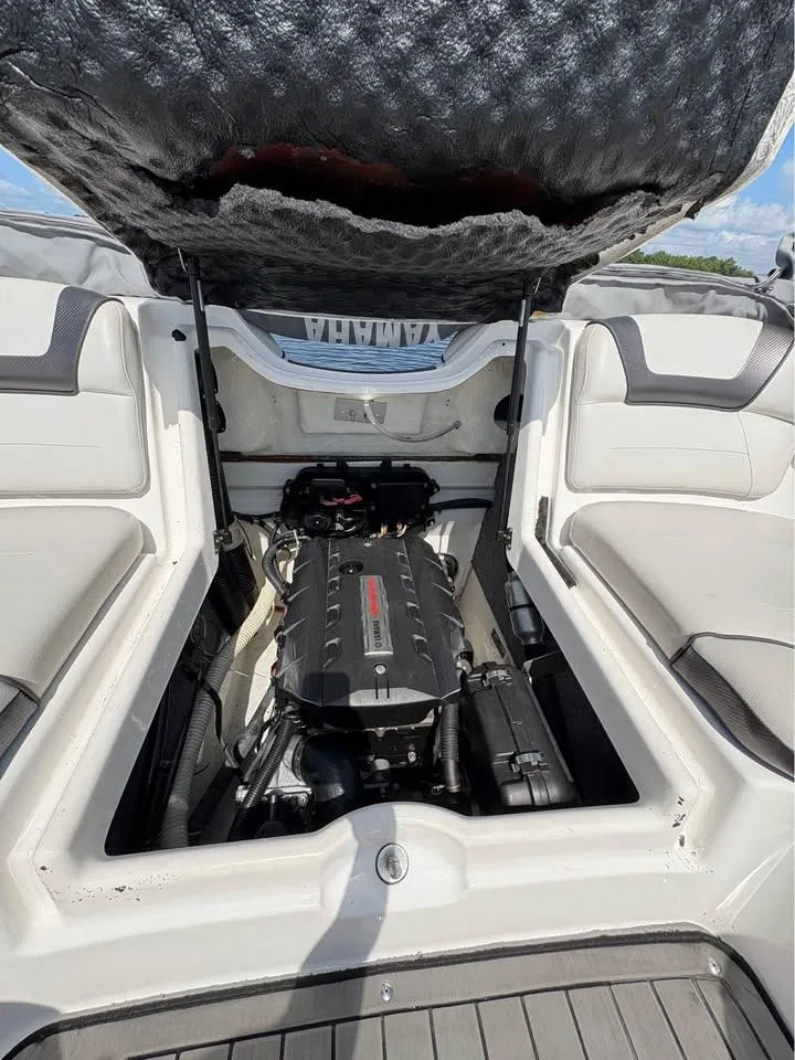 Slide: The Image of 2014 Yamaha Boats SX192 engine compartment with open hatch, showcasing interior components. - 10