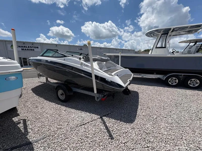 Slide: The Image of 2014 Yamaha SX192 boat on trailer at Charleston Marine under a cloudy sky. - 3