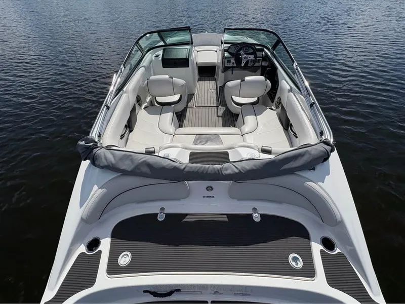 Slide: The Image of 2014 Yamaha SX192 boat interior with seating, steering, and water view. - 5