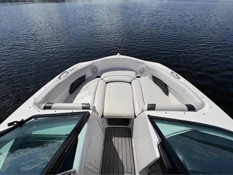 Slide: The Image of 2014 Yamaha Boats SX192 bow with seating, on calm water. - 7