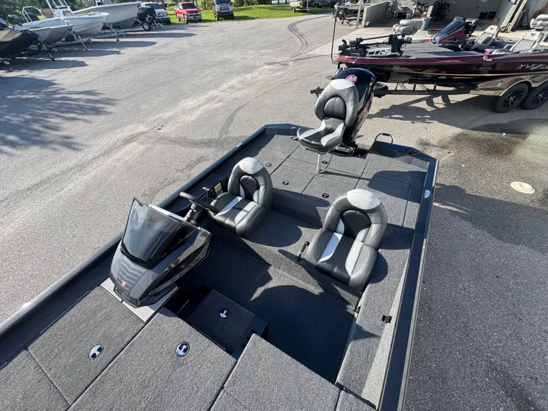 Slide: The Image of 2026 Vexus AVX1980 boat with sleek seating and modern design in a showroom. - 10