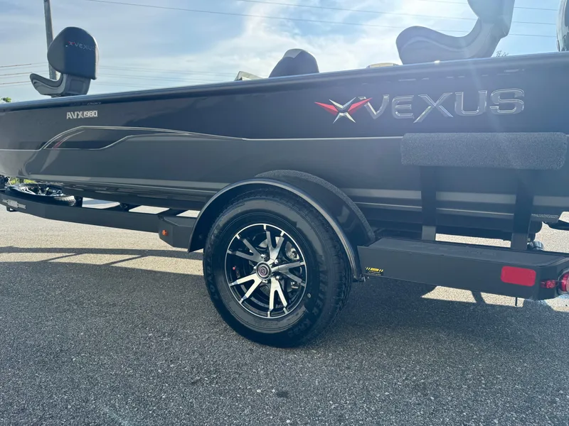 Slide: The Image of 2026 Vexus AVX1980 boat on trailer, showcasing sleek design and modern features. - 14