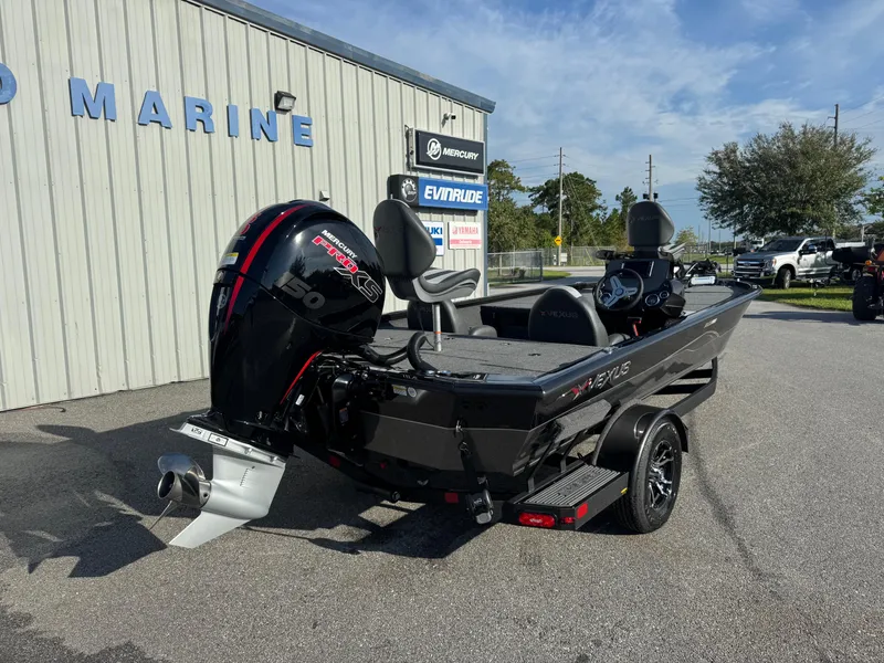 Slide: The Image of 2026 Vexus AVX1980 boat with Mercury Pro XS engine, parked outside a marine dealership. - 16