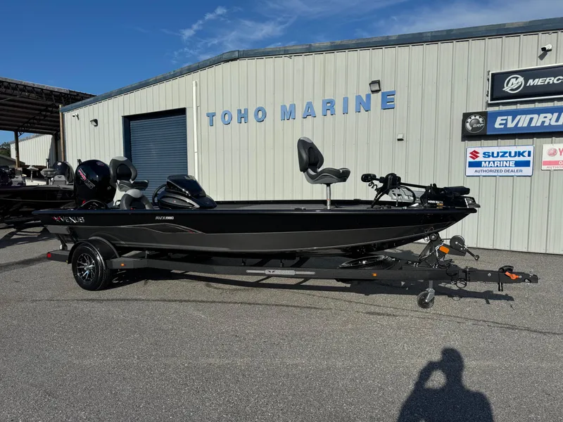 Slide: The Image of 2026 Vexus AVX1980 boat at Toho Marine dealership, featuring sleek black design. - 2
