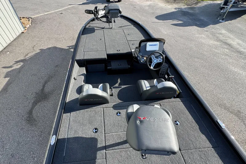 Slide: The Image of 2026 Vexus AVX1980 boat interior with steering console and seating. - 4