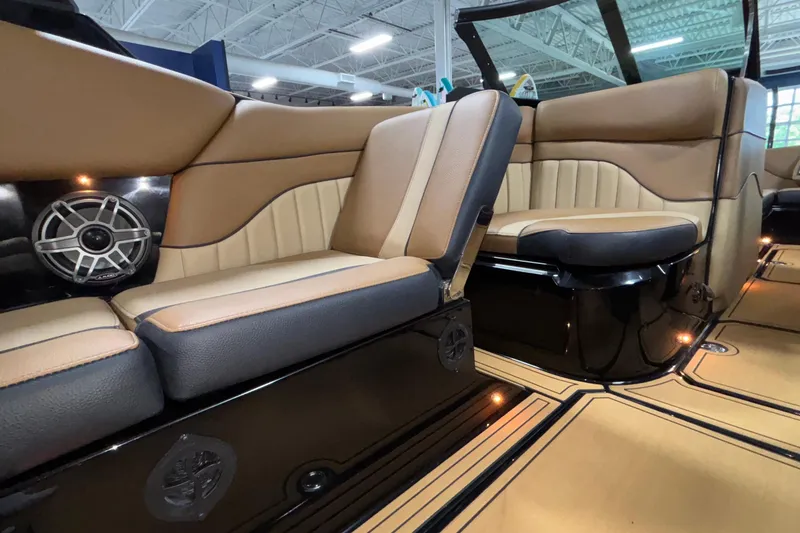 Slide: The Image of Luxurious interior of 2025 MB B52 25 Alpha boat with tan and black seating. - 11