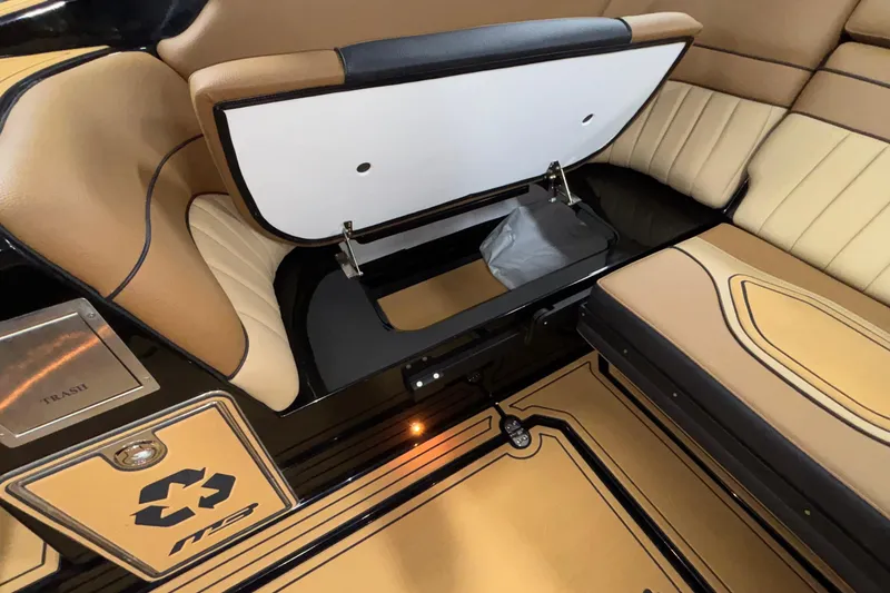 Slide: The Image of Interior of 2025 MB B52 25 Alpha boat with storage compartment and seating. - 16