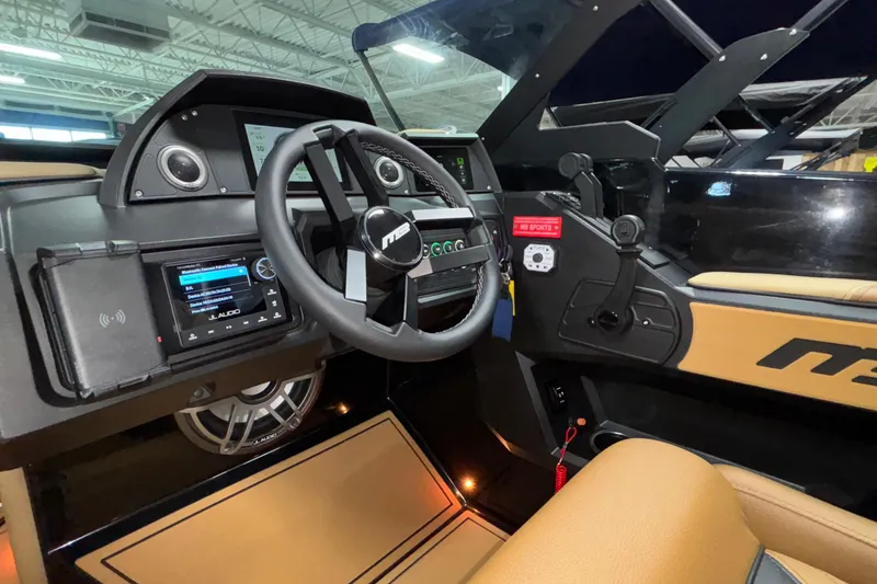 Slide: The Image of Interior view of 2025 MB B52 25 Alpha boat cockpit with advanced controls and steering wheel. - 19