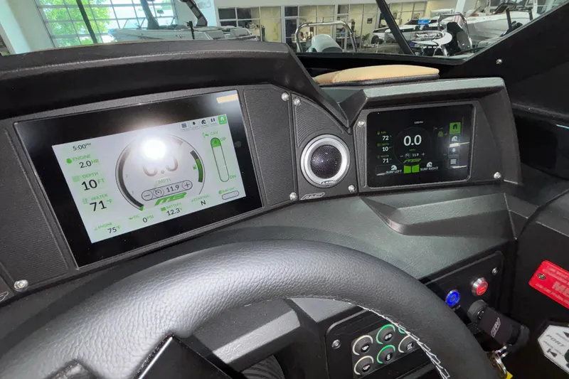 Slide: The Image of Dashboard of 2025 MB B52 25 Alpha boat with digital displays and controls. - 21