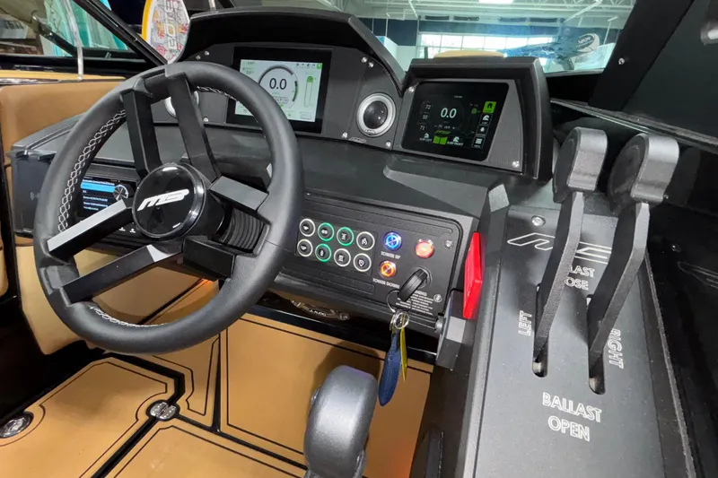 Slide: The Image of Interior of 2025 MB B52 25 Alpha boat with advanced dashboard controls. - 23