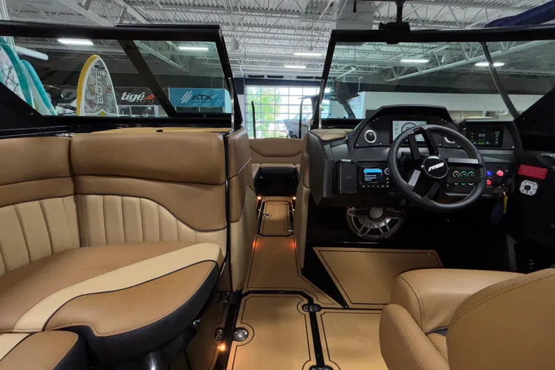 Slide: The Image of Interior of 2025 MB B52 25 Alpha boat with modern dashboard and tan seating. - 29