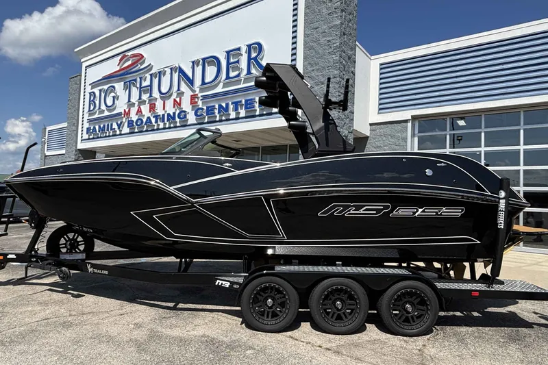 The Image of 2025 MB B52 25 Alpha boat at Big Thunder Marine dealership, sleek black design. - 0
